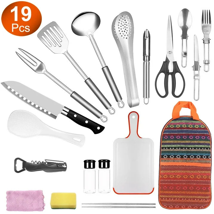 19-piece camping cooking utensil kit laid out with stainless tools and cutting board