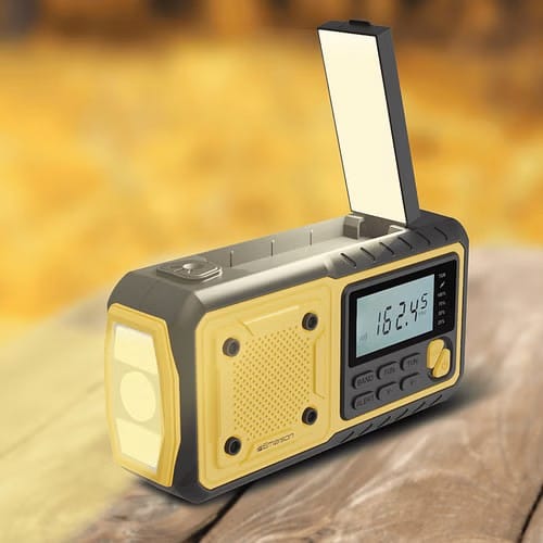 Emergency radio on a table providing weather updates and device charging during a power outage
