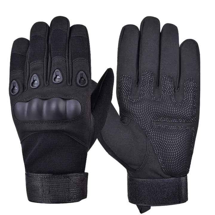 Black tactical hard-knuckle gloves with full-finger coverage, impact protection and secure hook-and-loop wrist closure